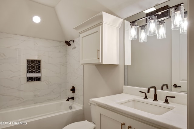 full bath featuring toilet, vanity, vaulted ceiling, and shower / bathtub combination