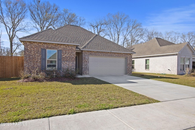 ranch-style home featuring concrete driveway, an attached garage, fence, a front yard, and brick siding