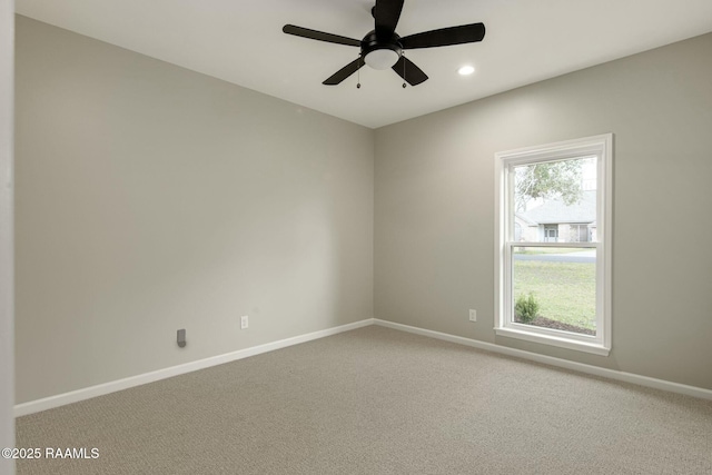 spare room with ceiling fan, recessed lighting, carpet, and baseboards