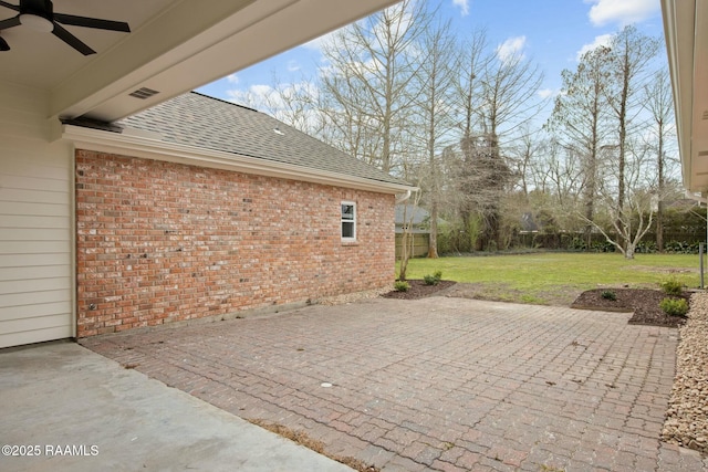 view of patio / terrace featuring fence and a ceiling fan