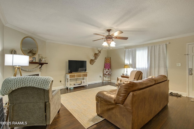 110 W Bayou Pkwy Unit 401, Lafayette, LA 70503 - living area with crown molding, ceiling fan, a textured ceiling, dark wood-style floors, and baseboards