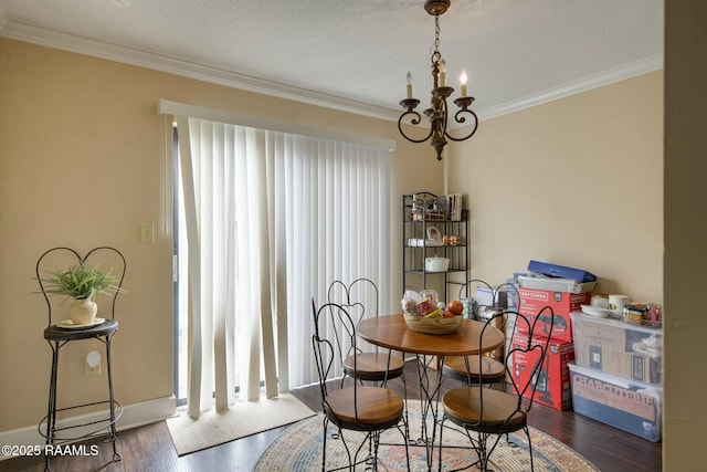 110 W Bayou Pkwy Unit 401, Lafayette, LA 70503 - dining area with healthy amount of natural light, ornamental molding, wood finished floors, a chandelier, and a textured ceiling