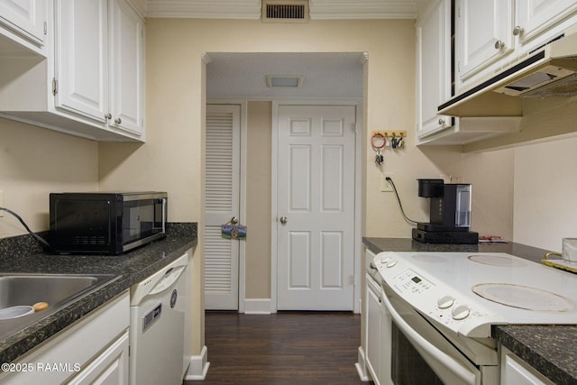 110 W Bayou Pkwy Unit 401, Lafayette, LA 70503 - kitchen featuring white appliances, white cabinets, dark wood-style flooring, dark countertops, and ornamental molding