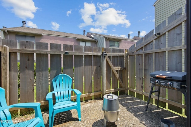 110 W Bayou Pkwy Unit 401, Lafayette, LA 70503 - view of patio featuring a gate and fence