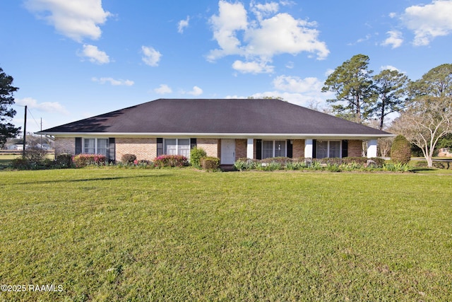 ranch-style home with brick siding and a front yard