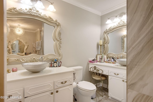 bathroom featuring vanity, toilet, and ornamental molding