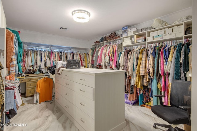 spacious closet with visible vents and marble finish floor