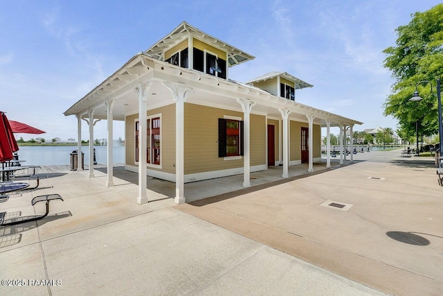 surrounding community featuring a water view