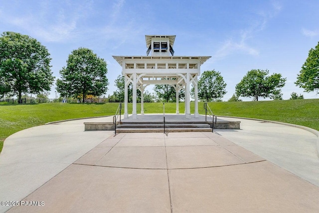 surrounding community with a gazebo, a patio area, and a yard