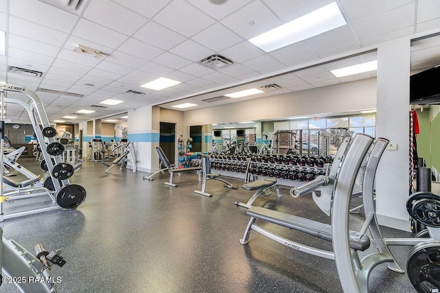 gym featuring visible vents and a drop ceiling