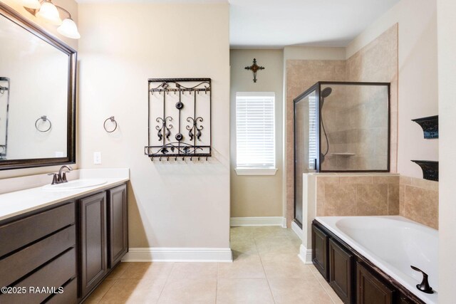 bathroom featuring vanity, tile patterned floors, a bath, and a stall shower