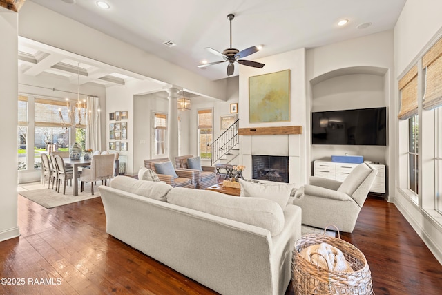 living area with a fireplace, coffered ceiling, dark wood-type flooring, and beamed ceiling