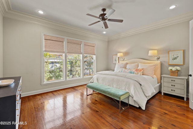 bedroom featuring ornamental molding, recessed lighting, baseboards, and hardwood / wood-style floors