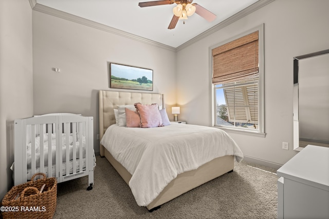 carpeted bedroom with ceiling fan, ornamental molding, and baseboards