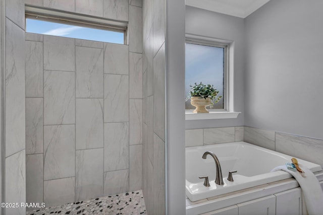 full bathroom featuring a garden tub and tiled shower