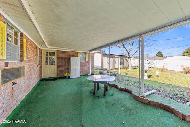 view of patio / terrace featuring an outdoor structure and fence