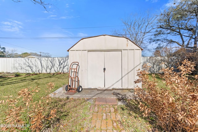 view of shed with fence