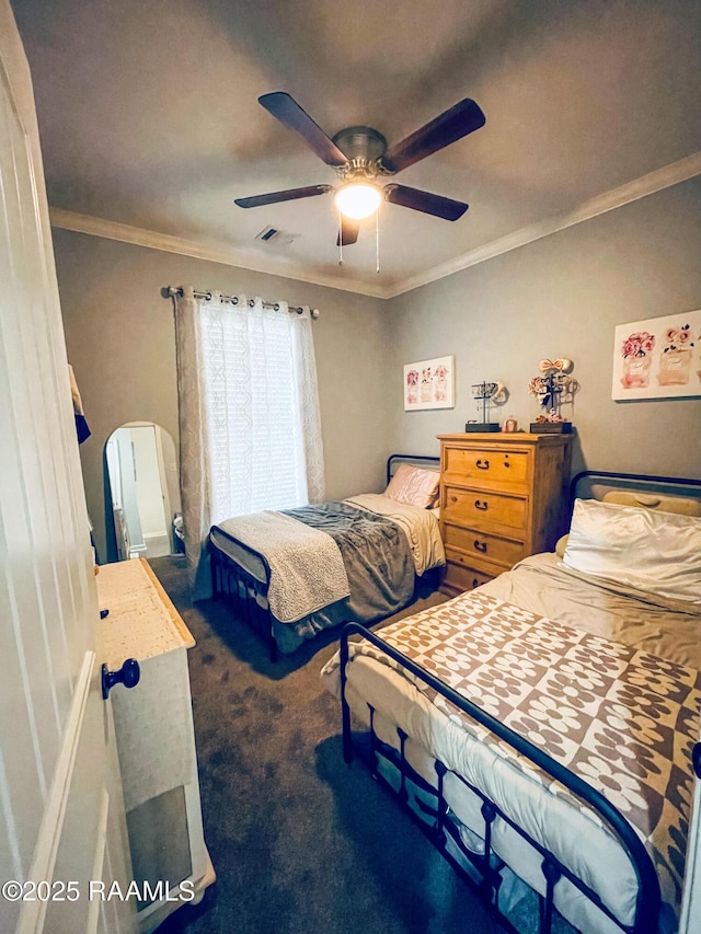 bedroom featuring carpet, visible vents, ceiling fan, and crown molding