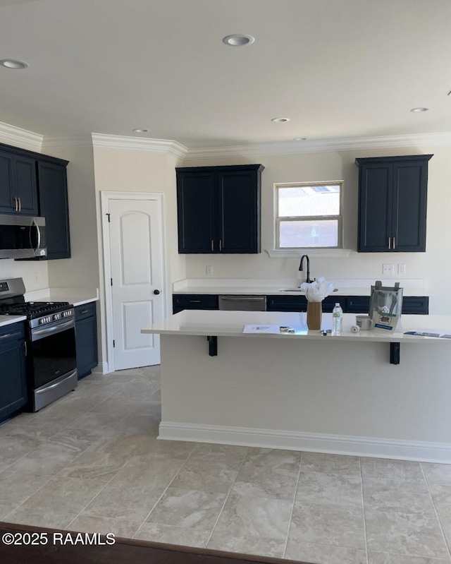 kitchen with a sink, stainless steel appliances, light countertops, and crown molding