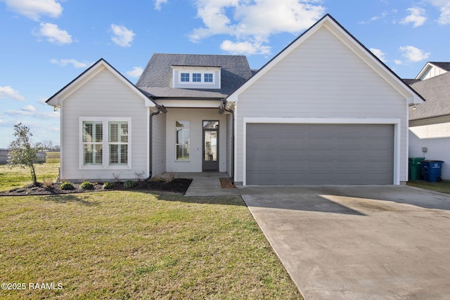 view of front of house featuring a garage, driveway, a shingled roof, and a front yard