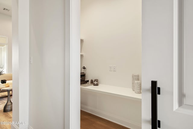 bathroom with visible vents and wood finished floors