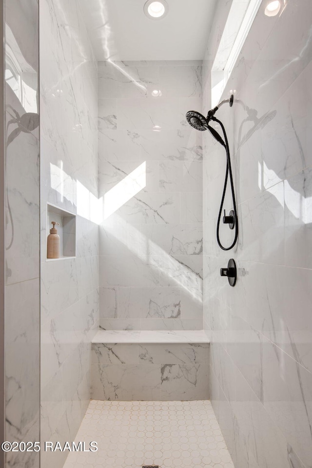 full bathroom with a marble finish shower