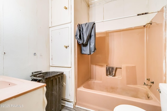 bathroom featuring bathing tub / shower combination and toilet