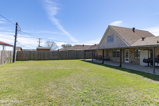 view of yard with a fenced backyard and a patio