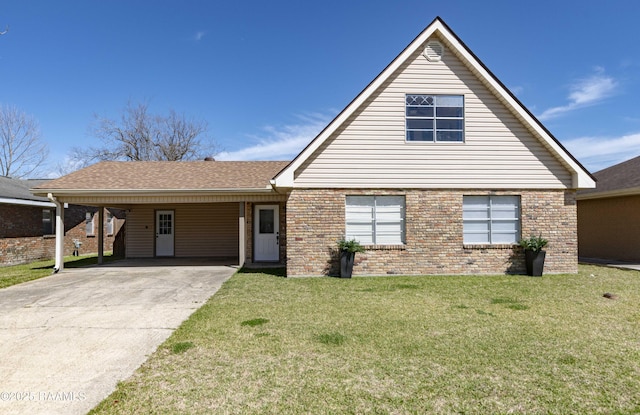 view of front facade with concrete driveway, an attached carport, roof with shingles, a front lawn, and brick siding