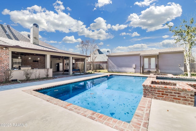 view of swimming pool featuring a fenced in pool, french doors, a patio, a ceiling fan, and fence