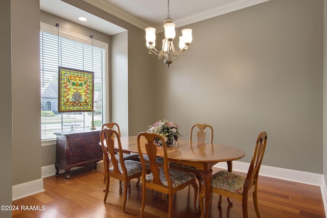 dining room featuring a wealth of natural light, baseboards, and wood finished floors