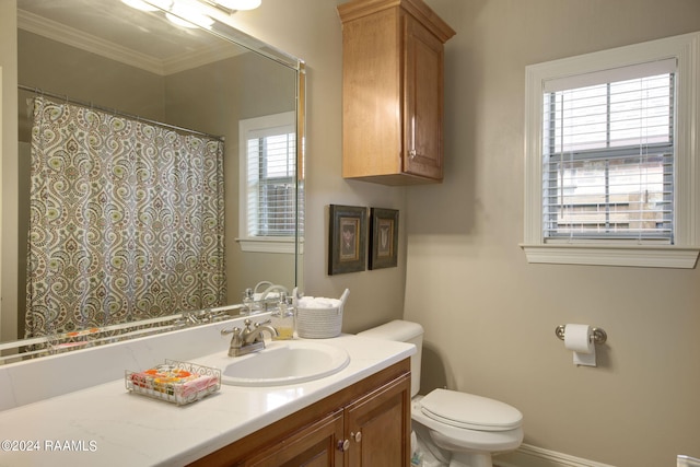 full bathroom with ornamental molding, vanity, toilet, and curtained shower