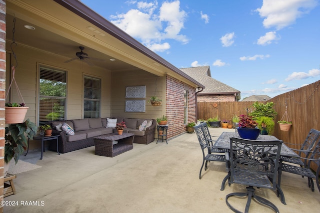 view of patio / terrace featuring outdoor dining space, a fenced backyard, ceiling fan, and an outdoor hangout area