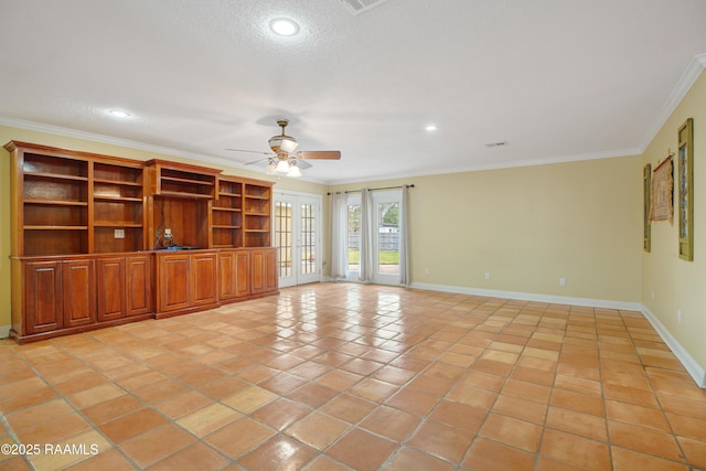 unfurnished living room featuring light tile patterned floors, a ceiling fan, baseboards, french doors, and crown molding