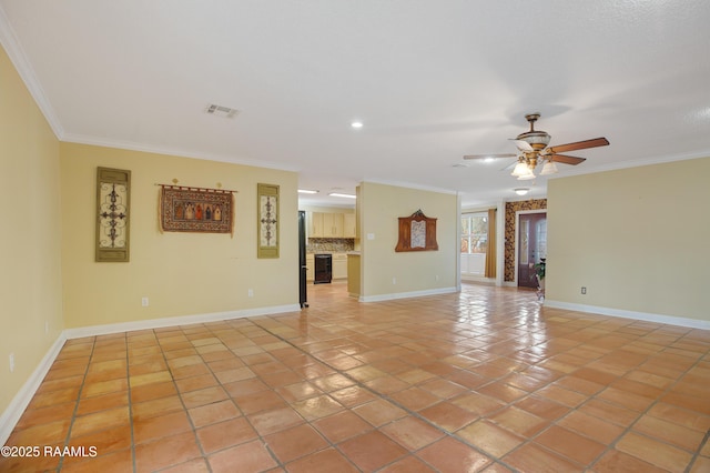 unfurnished living room with light tile patterned floors, ceiling fan, a fireplace, baseboards, and ornamental molding