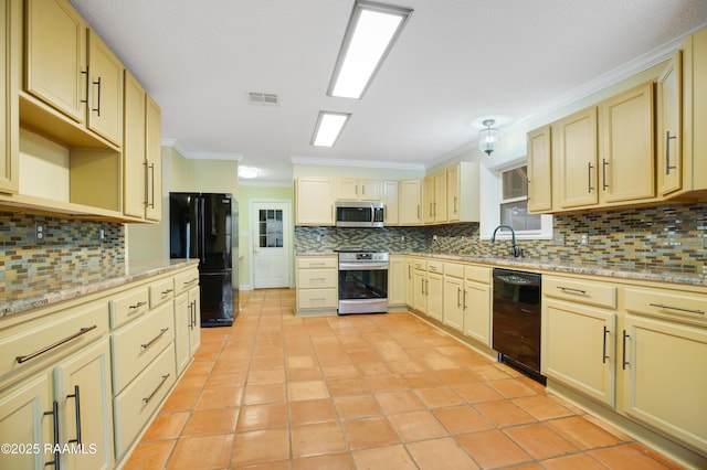 kitchen featuring visible vents, decorative backsplash, ornamental molding, black appliances, and a sink