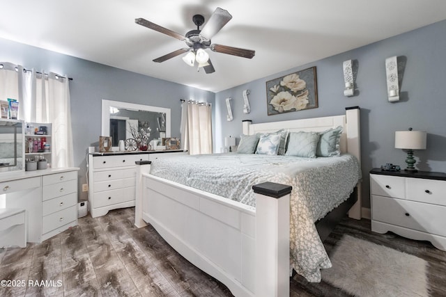 bedroom featuring dark wood-style floors and a ceiling fan