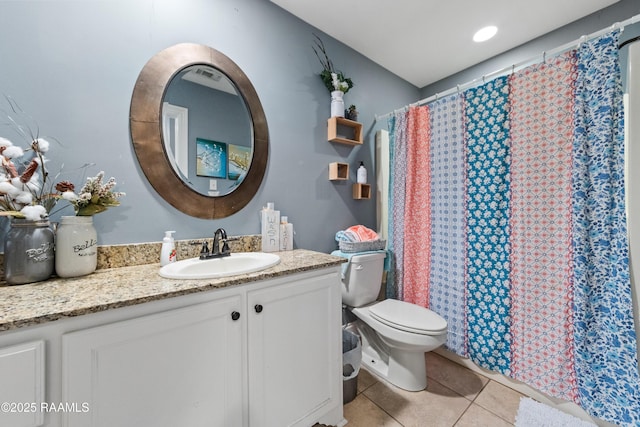 bathroom featuring vanity, tile patterned floors, toilet, and a shower with curtain