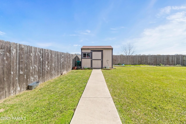 view of yard with an outbuilding, a storage unit, and a fenced backyard