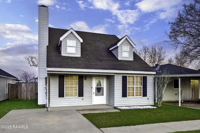 cape cod house featuring a chimney, fence, a porch, and a front yard