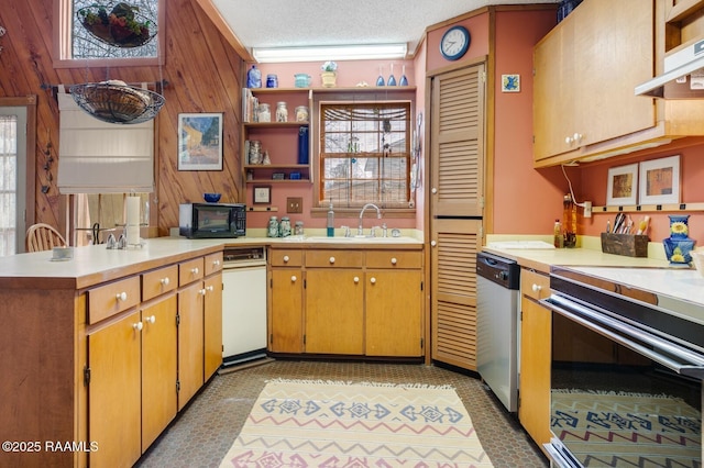 kitchen with black microwave, under cabinet range hood, a sink, dishwasher, and open shelves