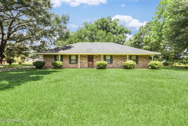 1410 S Chataignier Rd, Ville Platte, LA 70586 - ranch-style home with a front yard and brick siding