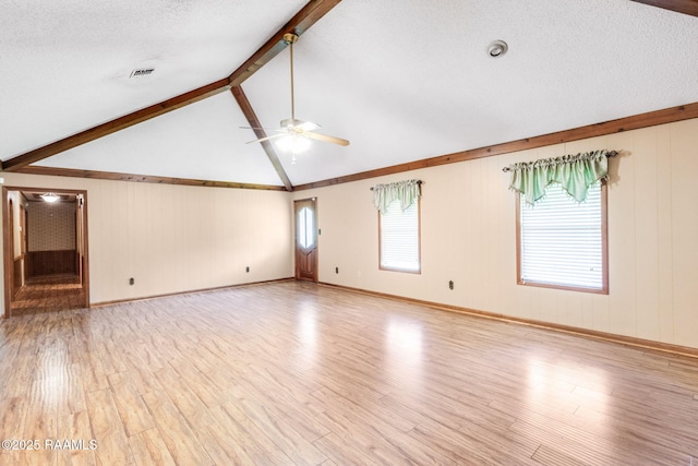 1410 S Chataignier Rd, Ville Platte, LA 70586 - empty room with ceiling fan, light wood-style flooring, and a textured ceiling