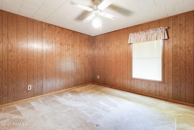 1410 S Chataignier Rd, Ville Platte, LA 70586 - carpeted empty room featuring a ceiling fan and wooden walls