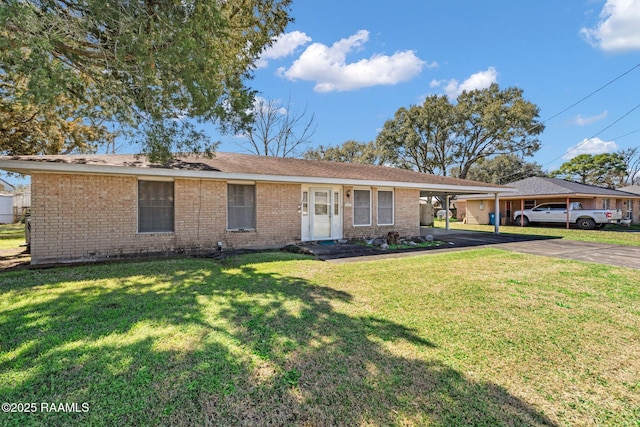 ranch-style house featuring driveway, a front lawn, a carport, and brick siding