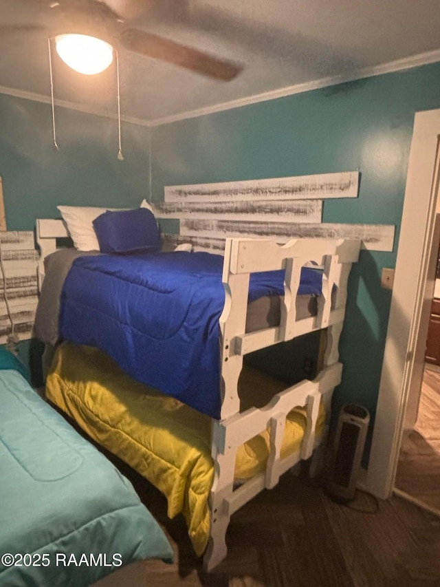 bedroom featuring crown molding and ceiling fan