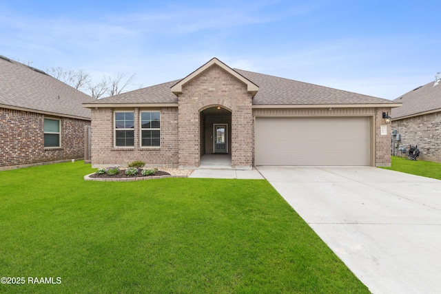 ranch-style home featuring brick siding, a shingled roof, a front yard, a garage, and driveway