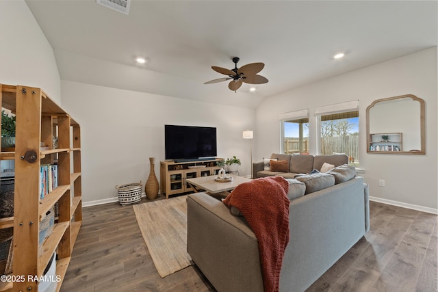 living area featuring lofted ceiling, ceiling fan, recessed lighting, visible vents, and dark wood finished floors