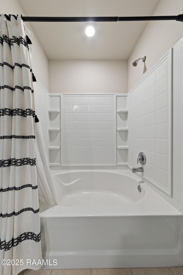 bathroom featuring shower / bath combo with shower curtain