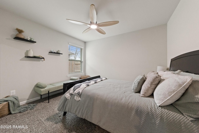 carpeted bedroom with a ceiling fan and baseboards